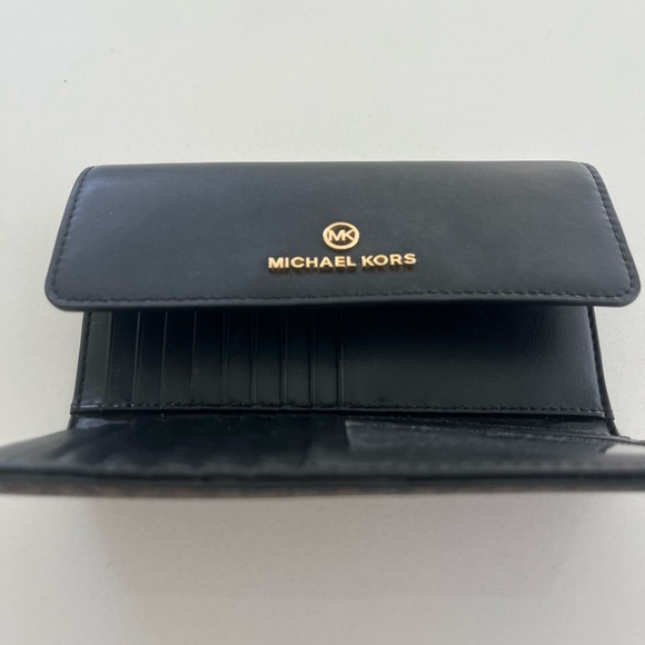 Michael Kors Black and Brown Logo Wallet
Trifold. - Picture 3 of 6
